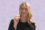 Video host against backdrop with budget related icons